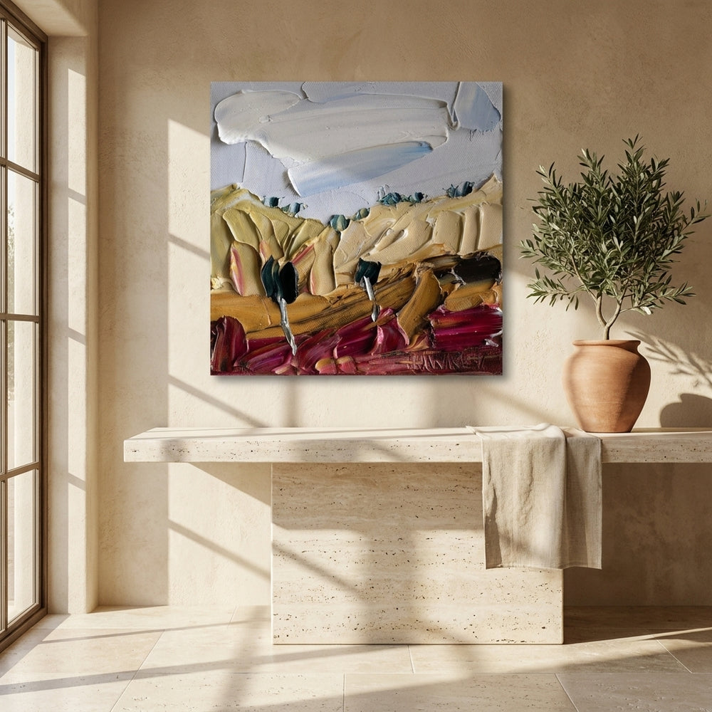 Stretched canvas wall art styled on the wall in a Mediterranean living room