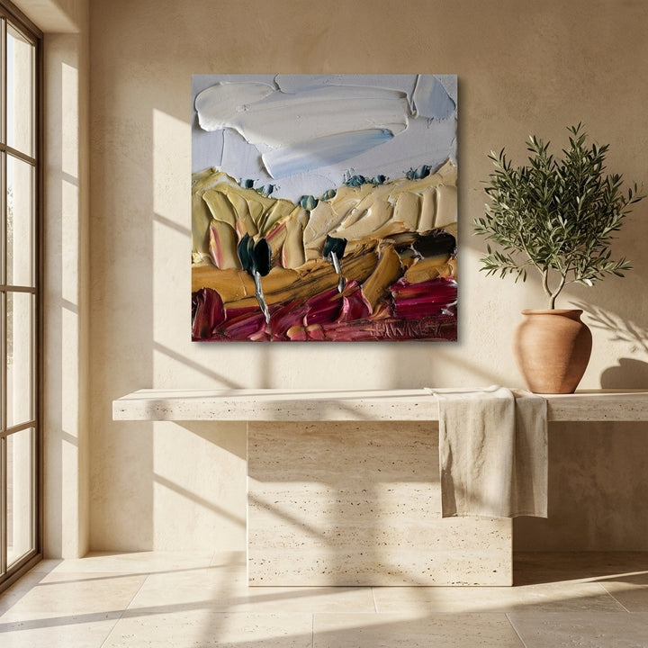 Stretched canvas wall art styled on the wall in a Mediterranean living room
