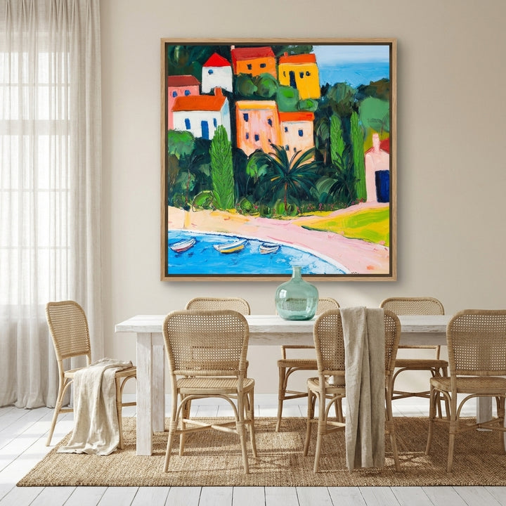 Oversized statement canvas wall art with a natural timber surround styled on the wall in a coastal dining room