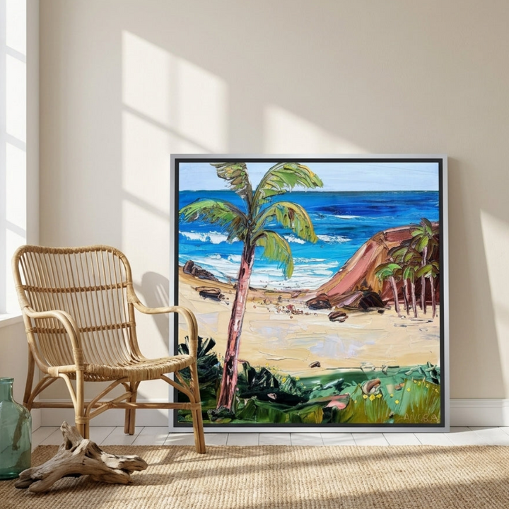 Canvas wall art with a silver leaf surround leaning against the wall in a coastal living room