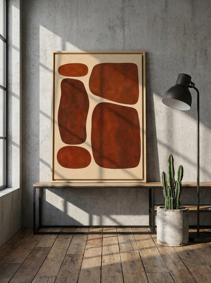 Canvas wall art with a natural timber surround standing on a console in an industrial loft home office