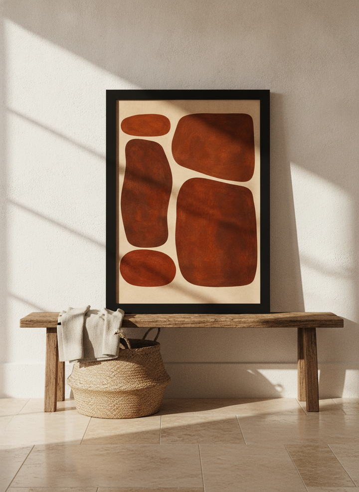 Modern wall art print standing on a bench in a Mediterranean bedroom