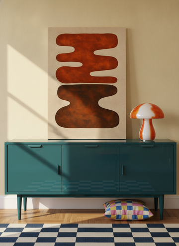 Stretched canvas wall art standing on a sideboard in a colourful eclectic home office