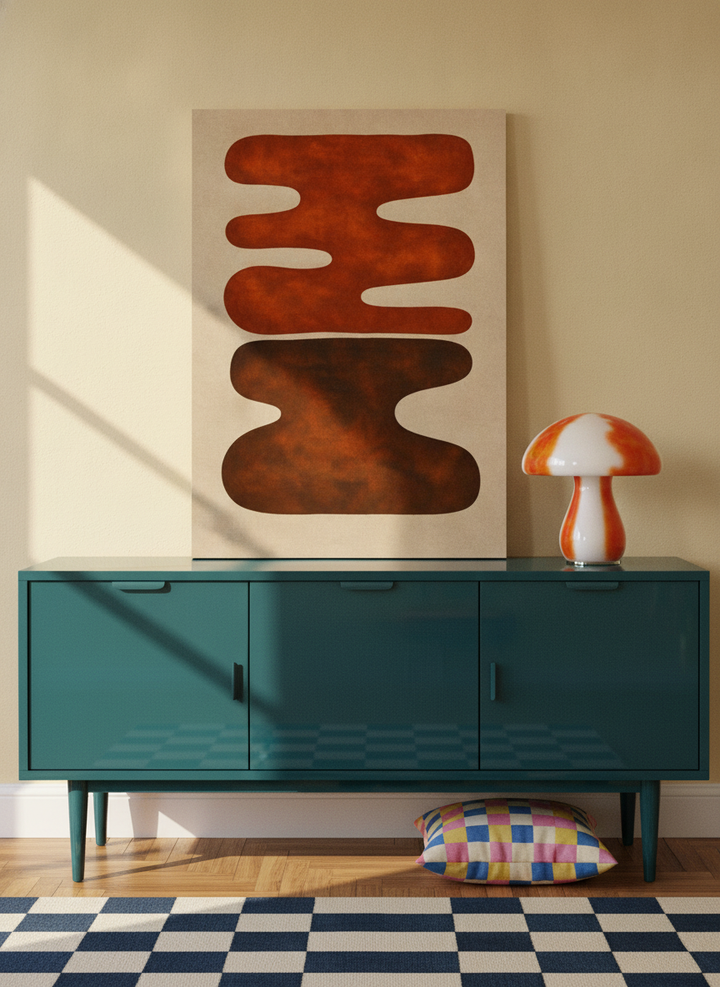 Stretched canvas wall art standing on a sideboard in a colourful eclectic home office