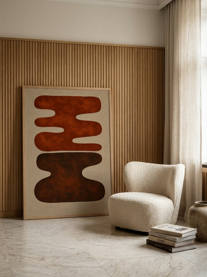 Oversized statement modern wall art print leaning against the wall in a luxe living room
