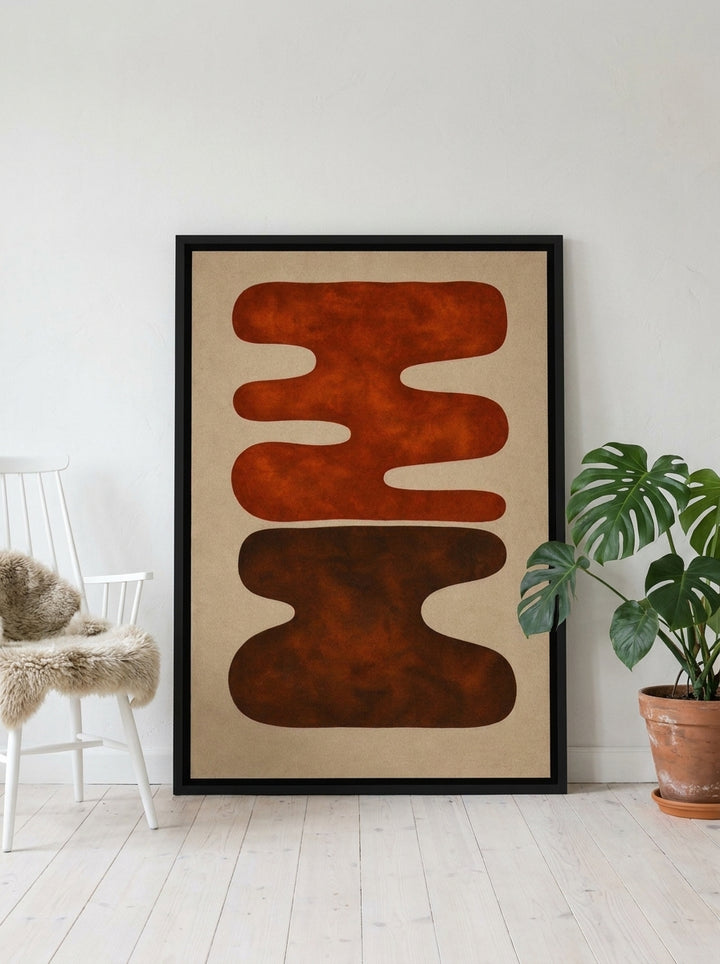 Canvas wall art with a black surround leaning against the wall in a bright Scandinavian living room