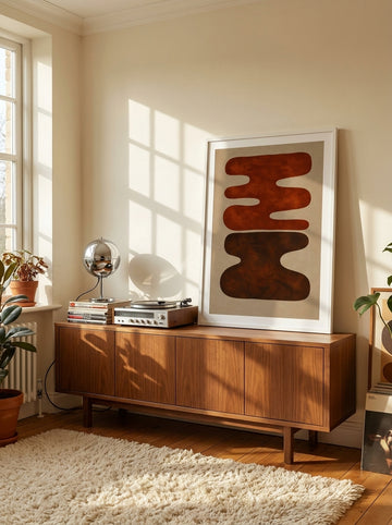 Modern wall art print standing on a sideboard in a retro 70s home office