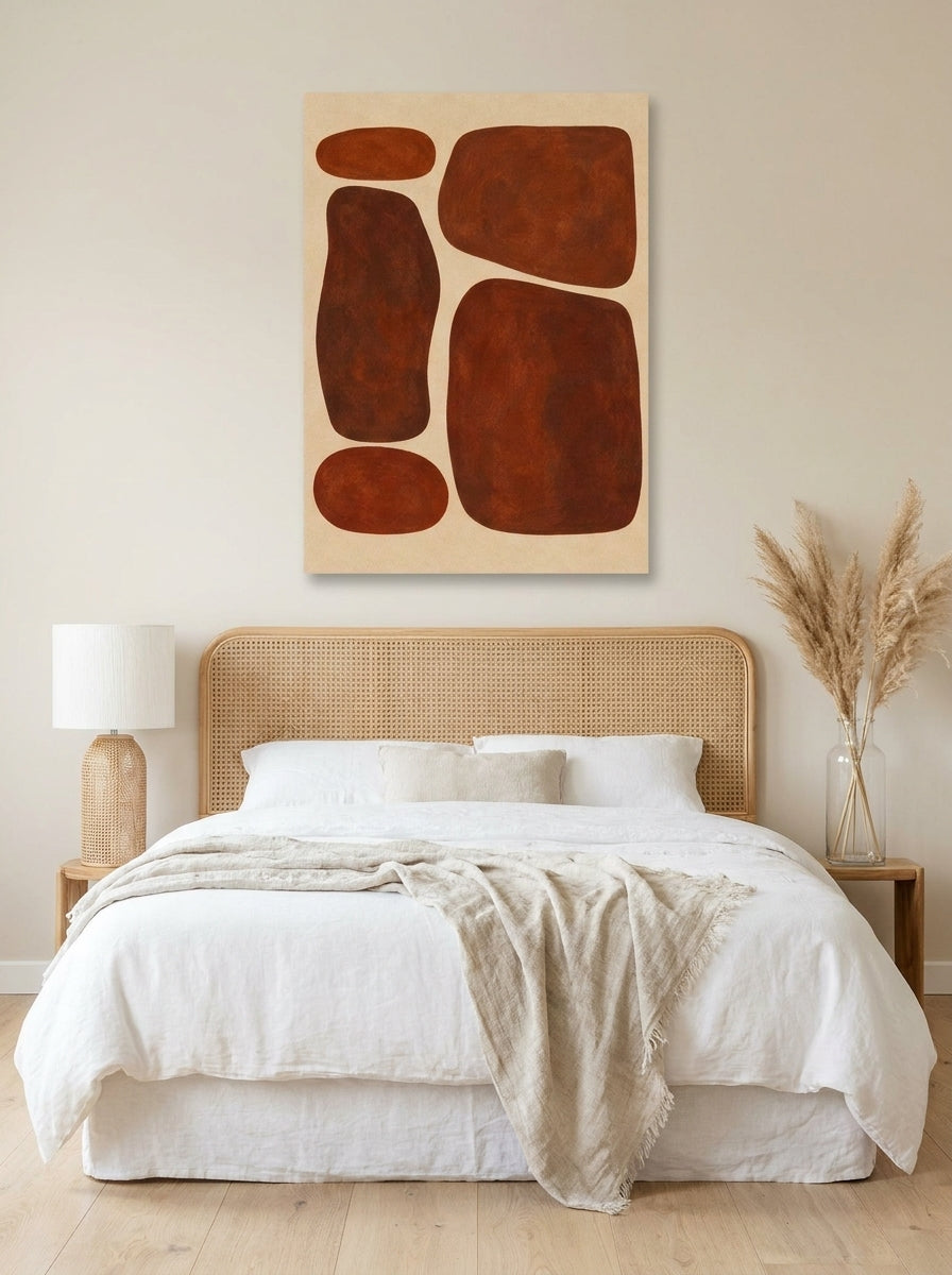 Stretched canvas wall art styled on the wall in a coastal bedroom