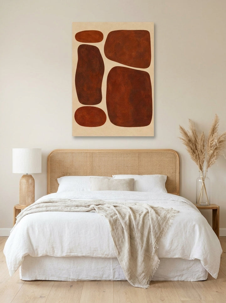 Stretched canvas wall art styled on the wall in a coastal bedroom