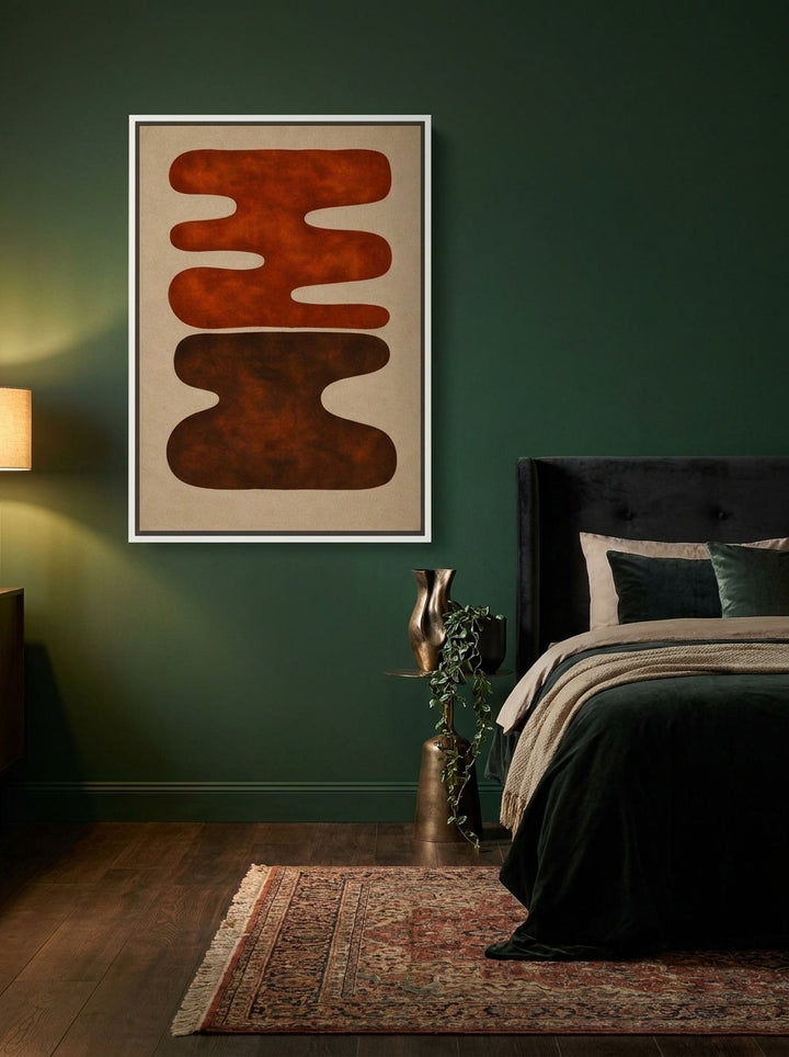 Canvas wall art with a white surround styled on the wall in a moody bedroom