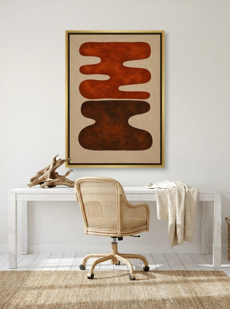 Canvas wall art with a gold leaf surround styled on the wall in a coastal home office