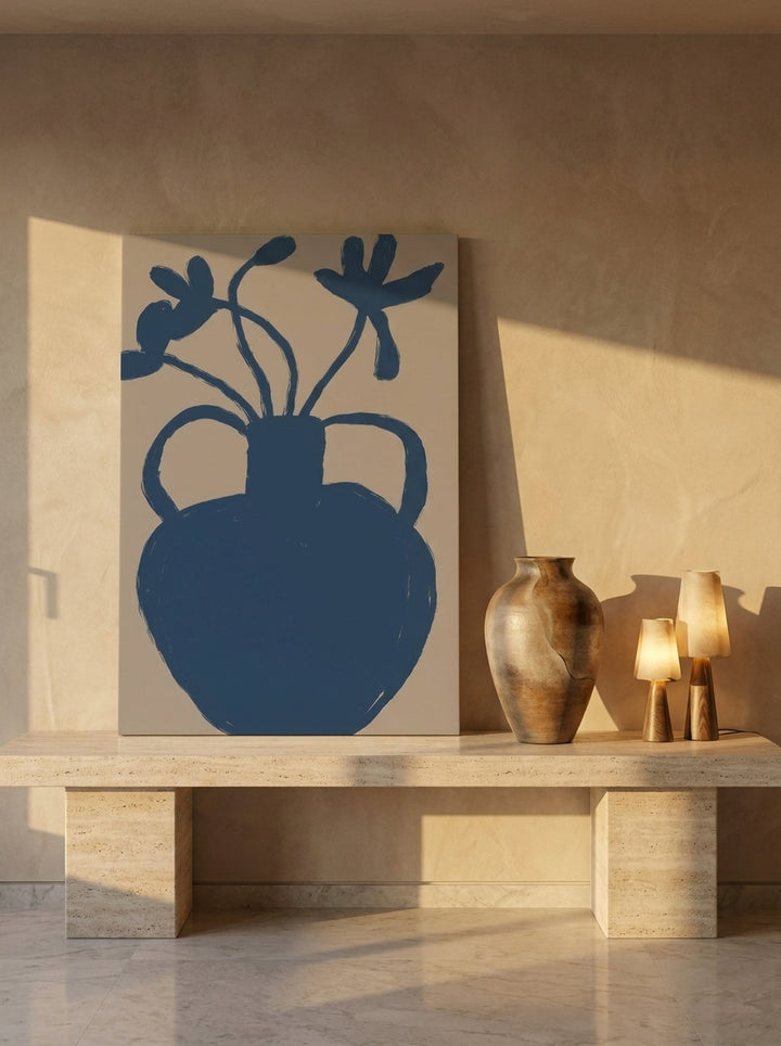 Stretched canvas wall art standing on a console in a luxe bedroom
