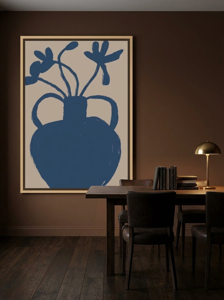 Oversized statement canvas wall art with a natural timber surround styled on the wall in a moody dining room