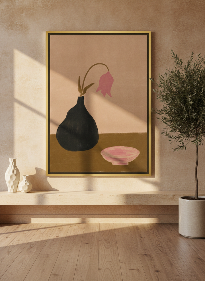 Oversized statement canvas wall art with a gold leaf surround styled on the wall in a luxe living room