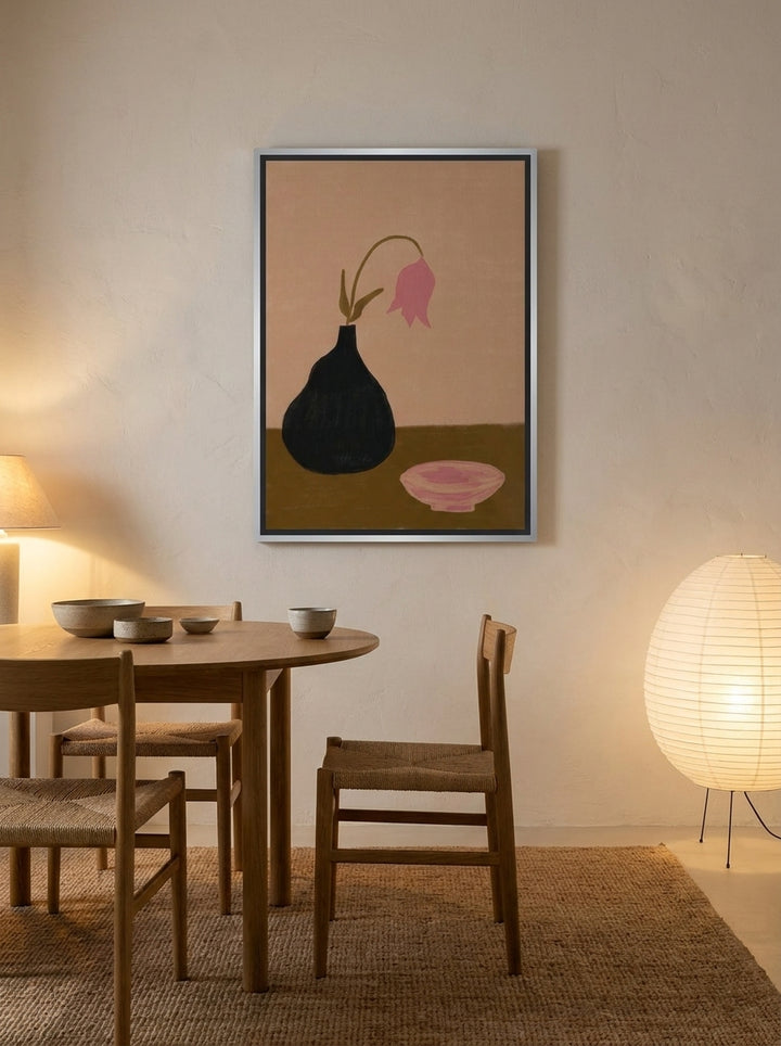 Canvas wall art with a silver leaf surround styled on the wall in a warm Japandi dining room