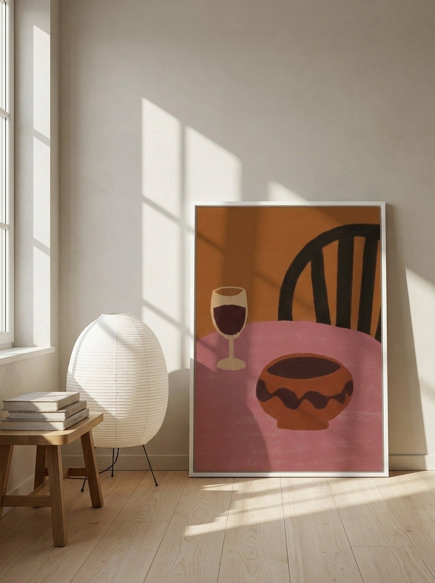 Canvas wall art with a white surround leaning against the wall in a warm Japandi kitchen