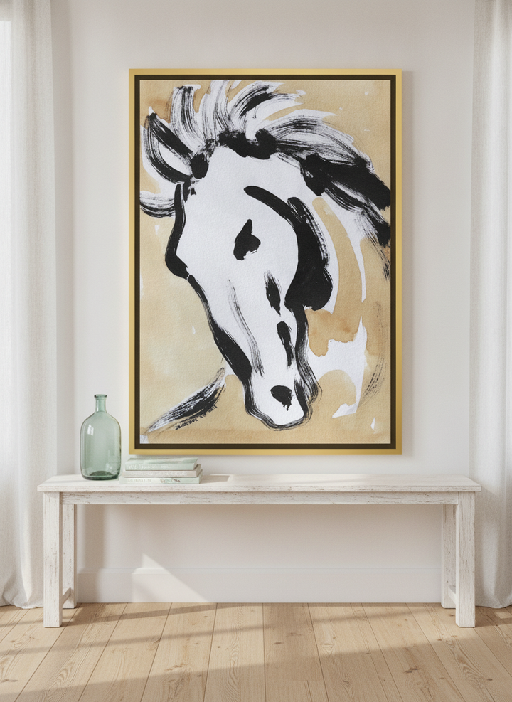 Canvas wall art with a gold leaf surround standing on a console in a coastal bedroom