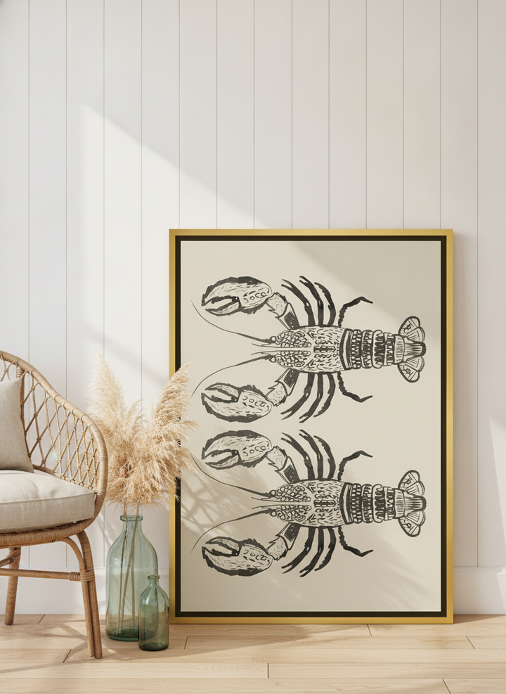 Canvas wall art with a gold leaf surround leaning against the wall in a coastal dining room