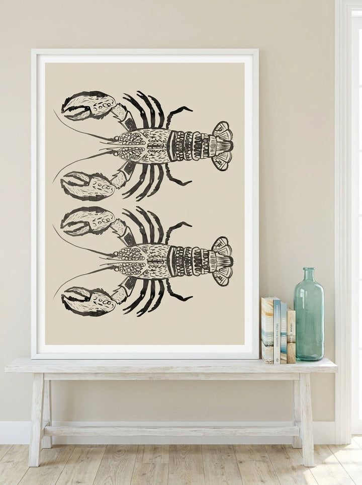 Modern wall art print standing on a console in a coastal bedroom