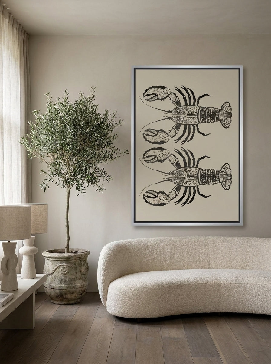 Canvas wall art with a silver leaf surround styled on the wall in a luxe living room