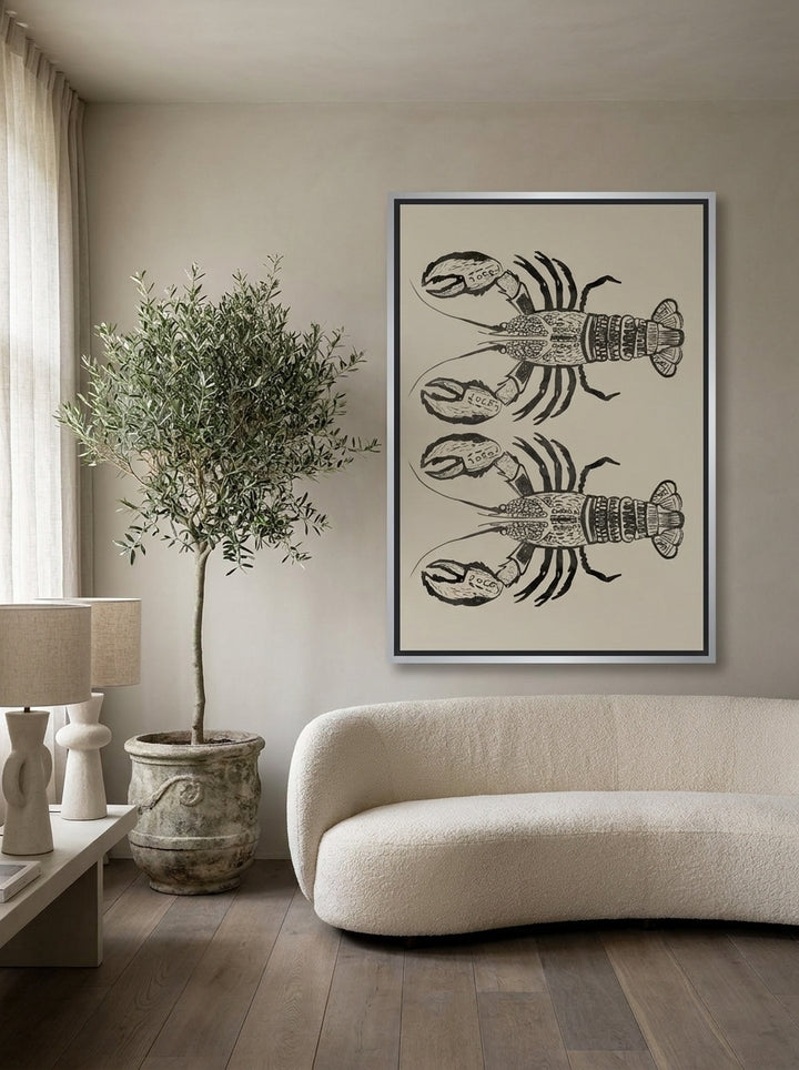 Canvas wall art with a silver leaf surround styled on the wall in a luxe living room