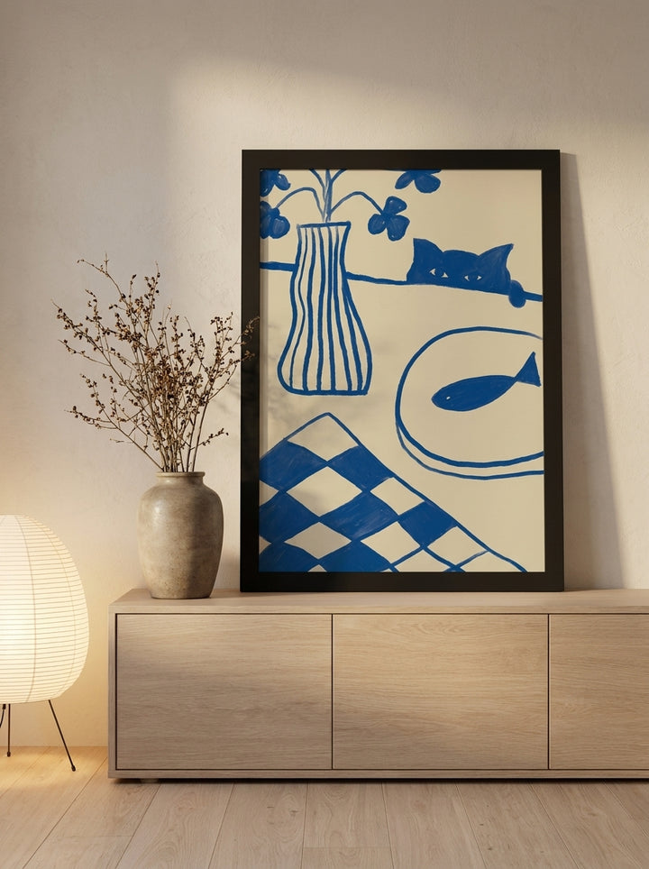 Modern wall art print standing on a sideboard in a warm Japandi bedroom