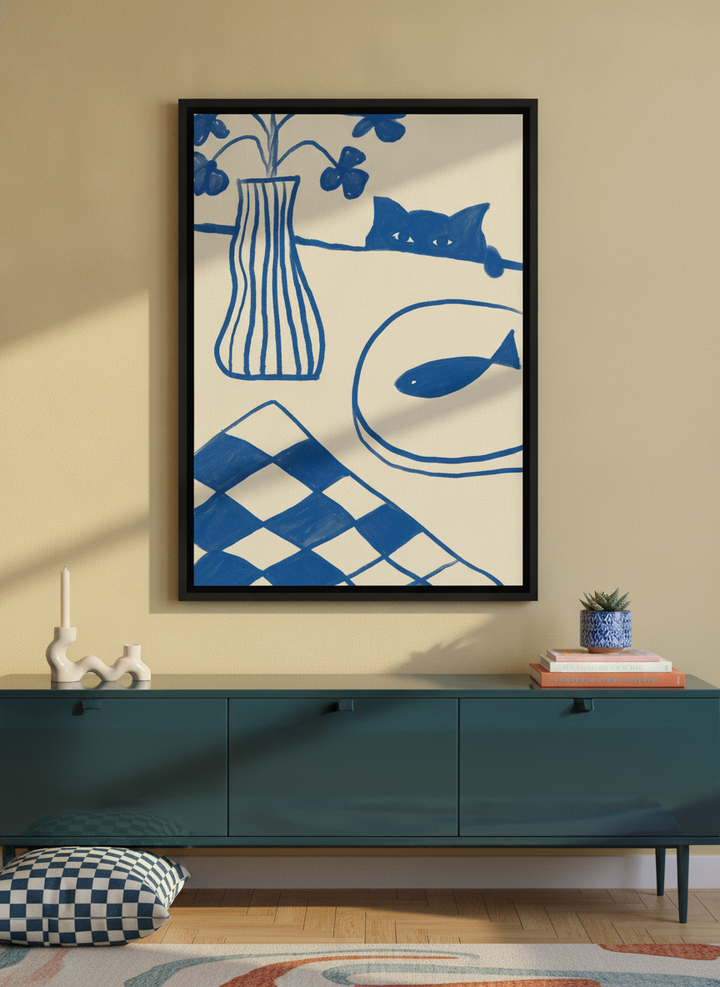 Canvas wall art with a black surround styled on the wall in a colourful eclectic living room