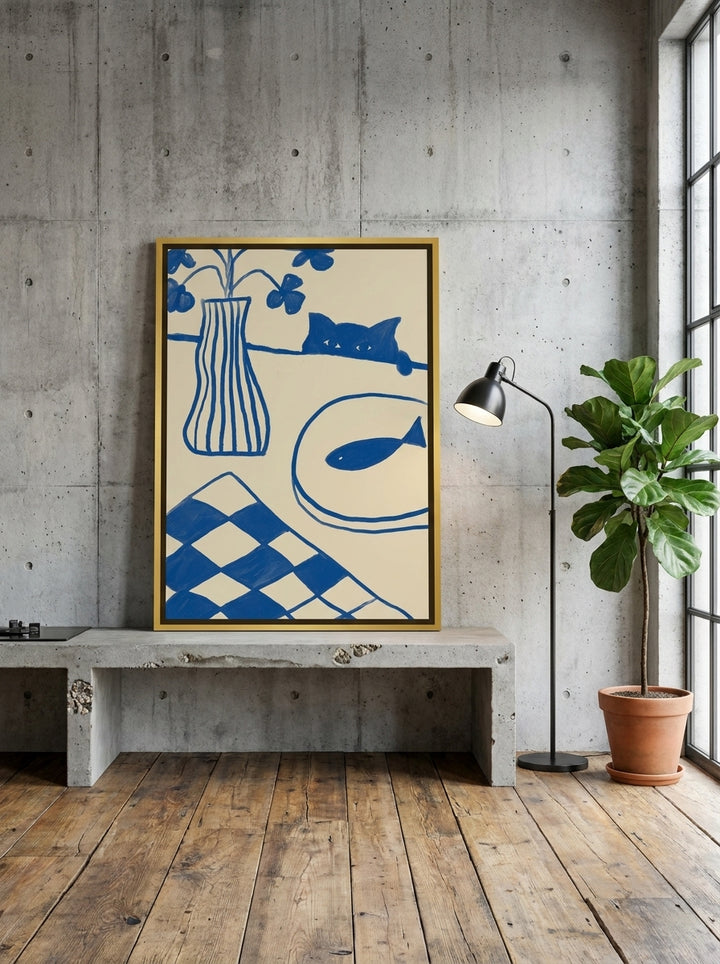 Canvas wall art with a gold leaf surround standing on a kitchen bench in an industrial loft kitchen