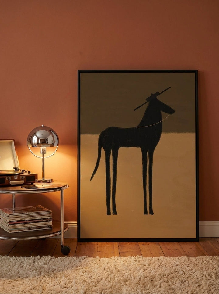 Canvas wall art with a black surround leaning against the wall in a retro 70s living room