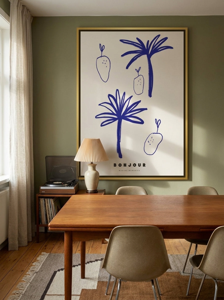 Oversized statement canvas wall art with a gold leaf surround styled on the wall in a mid-century dining room