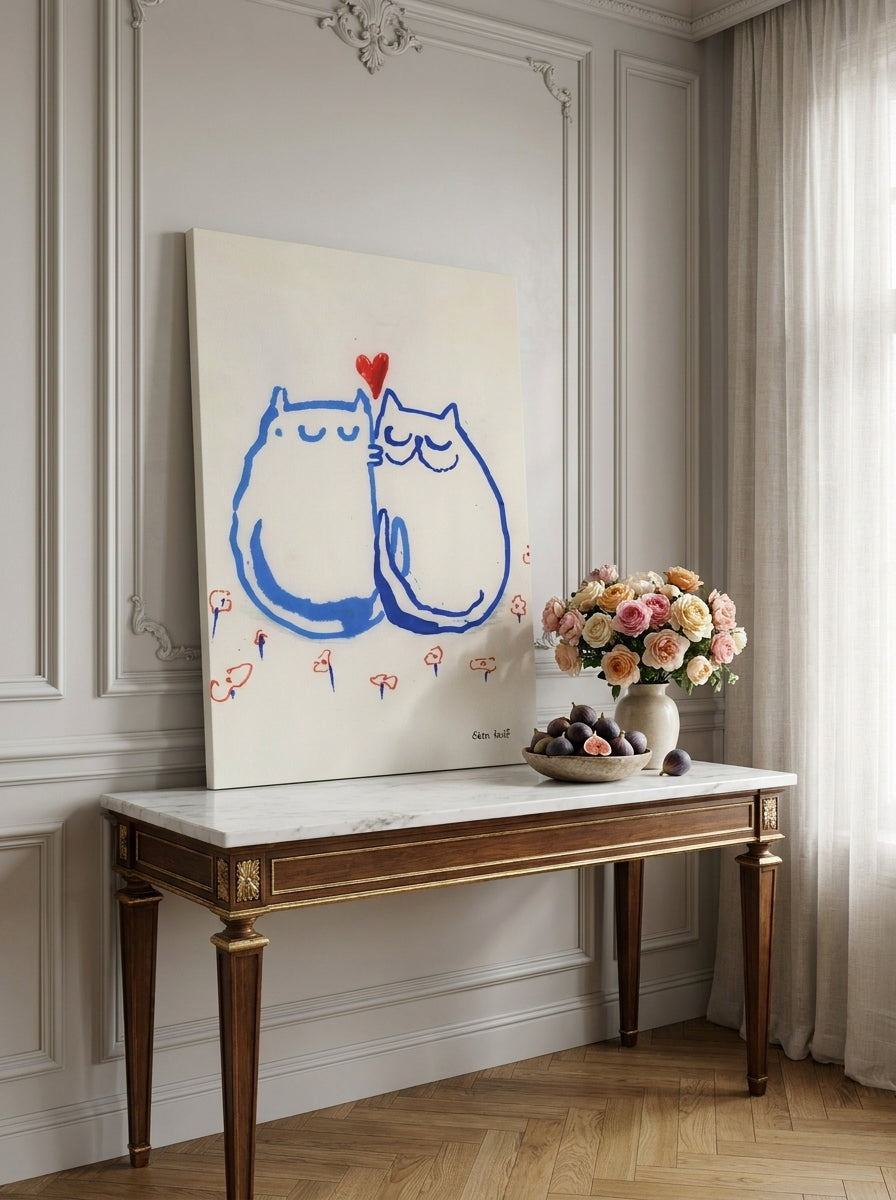 Stretched canvas wall art standing on a console in a Parisian living room