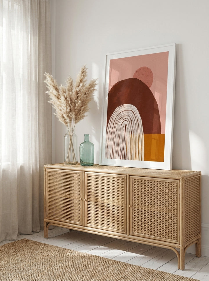 Modern wall art print standing on a sideboard in a coastal bedroom