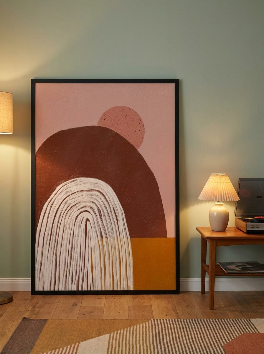 Oversized statement modern wall art print leaning against the wall in a mid-century bedroom