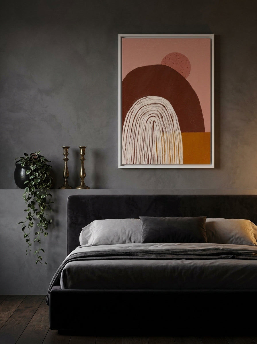 Canvas wall art with a white surround styled on the wall in a moody bedroom