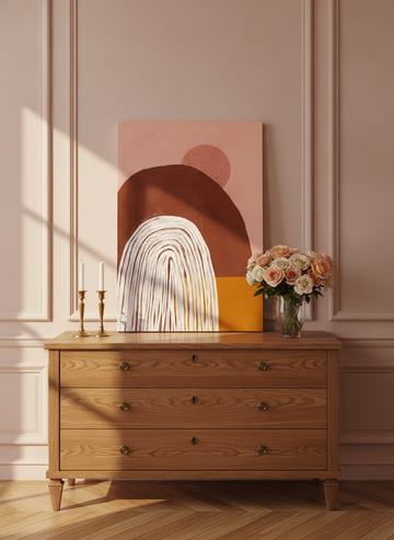 Stretched canvas wall art standing on a sideboard in a Parisian home office