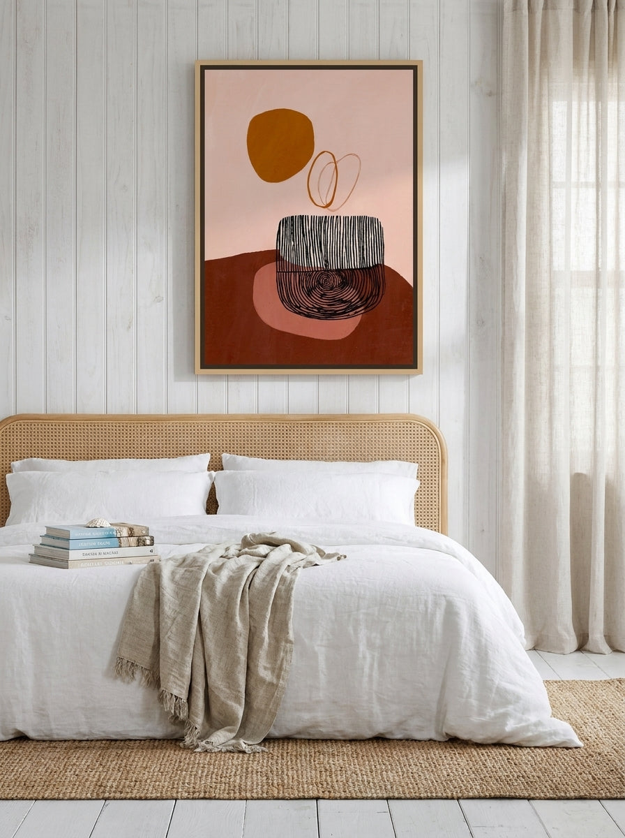 Canvas wall art with a natural timber surround styled on the wall in a coastal bedroom