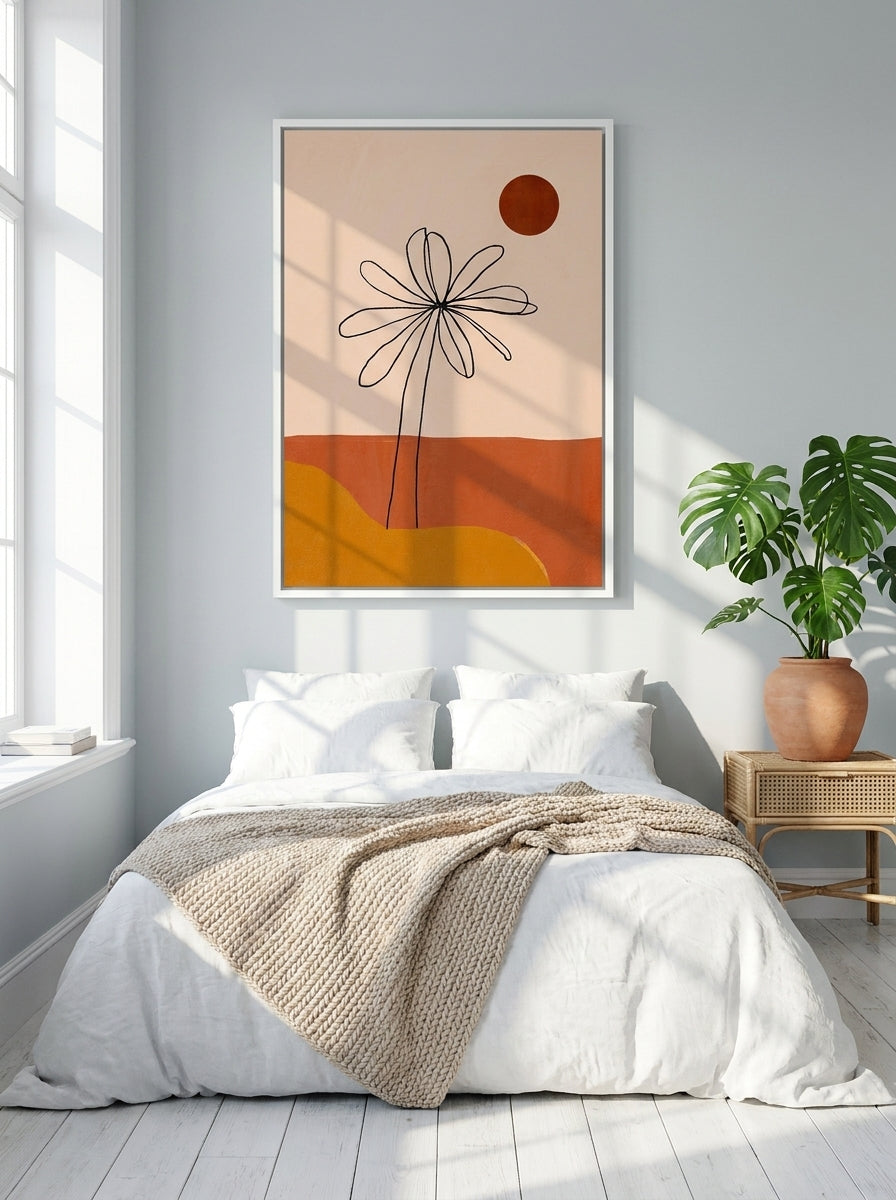 Canvas wall art with a white surround styled on the wall in a bright Scandinavian bedroom