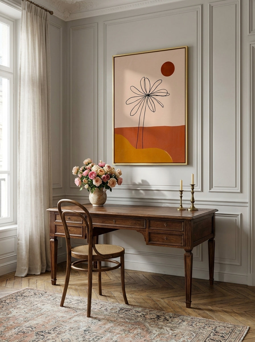 Canvas wall art with a gold leaf surround styled on the wall in a Parisian home office