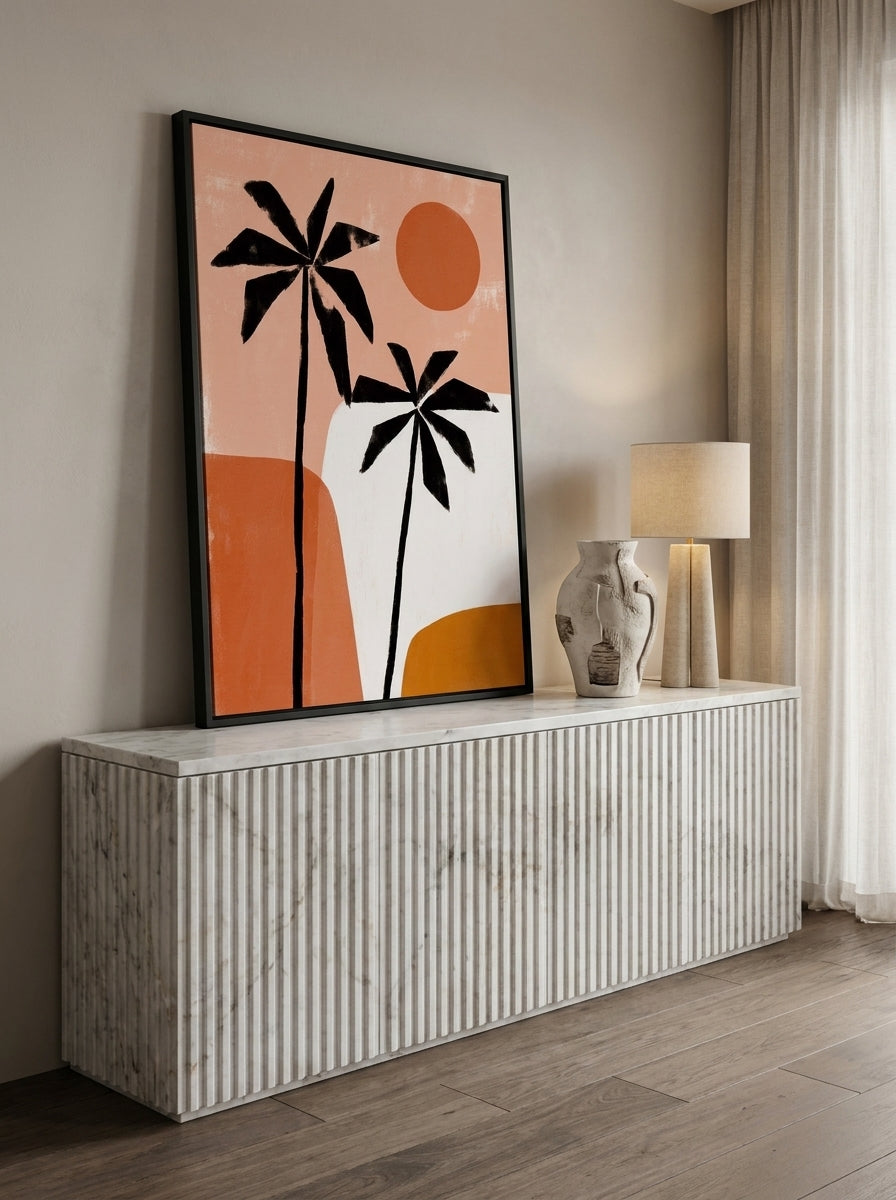 Canvas wall art with a black surround standing on a sideboard in a luxe home office