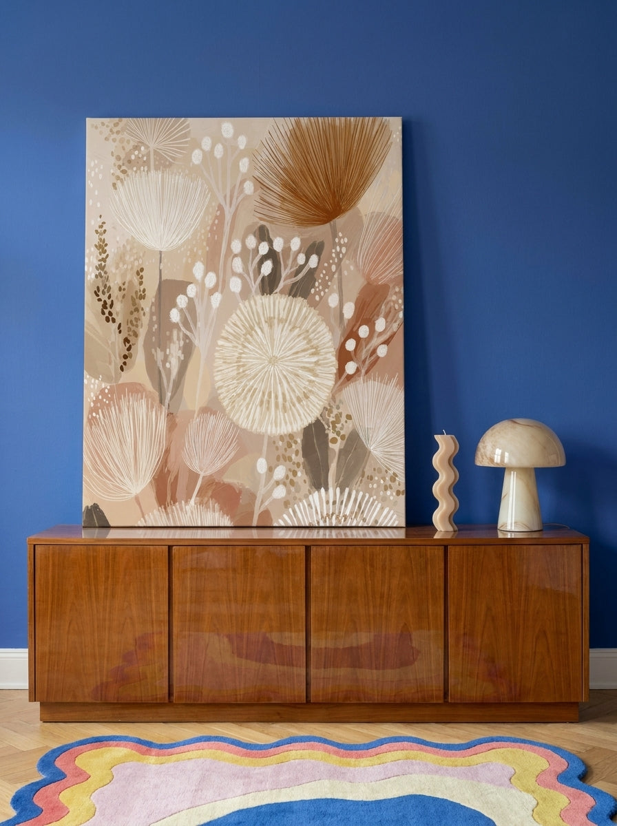 Stretched canvas wall art standing on a sideboard in a colourful eclectic bedroom
