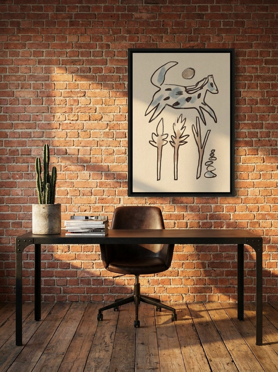 Canvas wall art with a black surround styled on the wall in an industrial loft home office