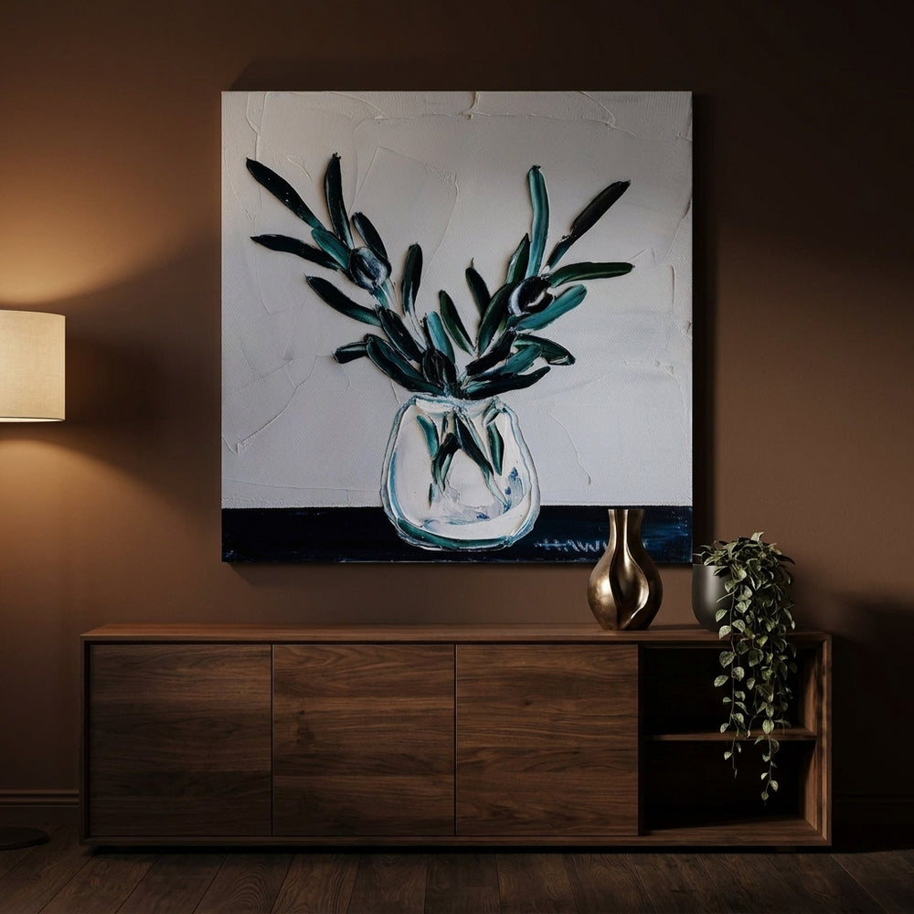 Stretched canvas wall art styled on the wall in a moody living room