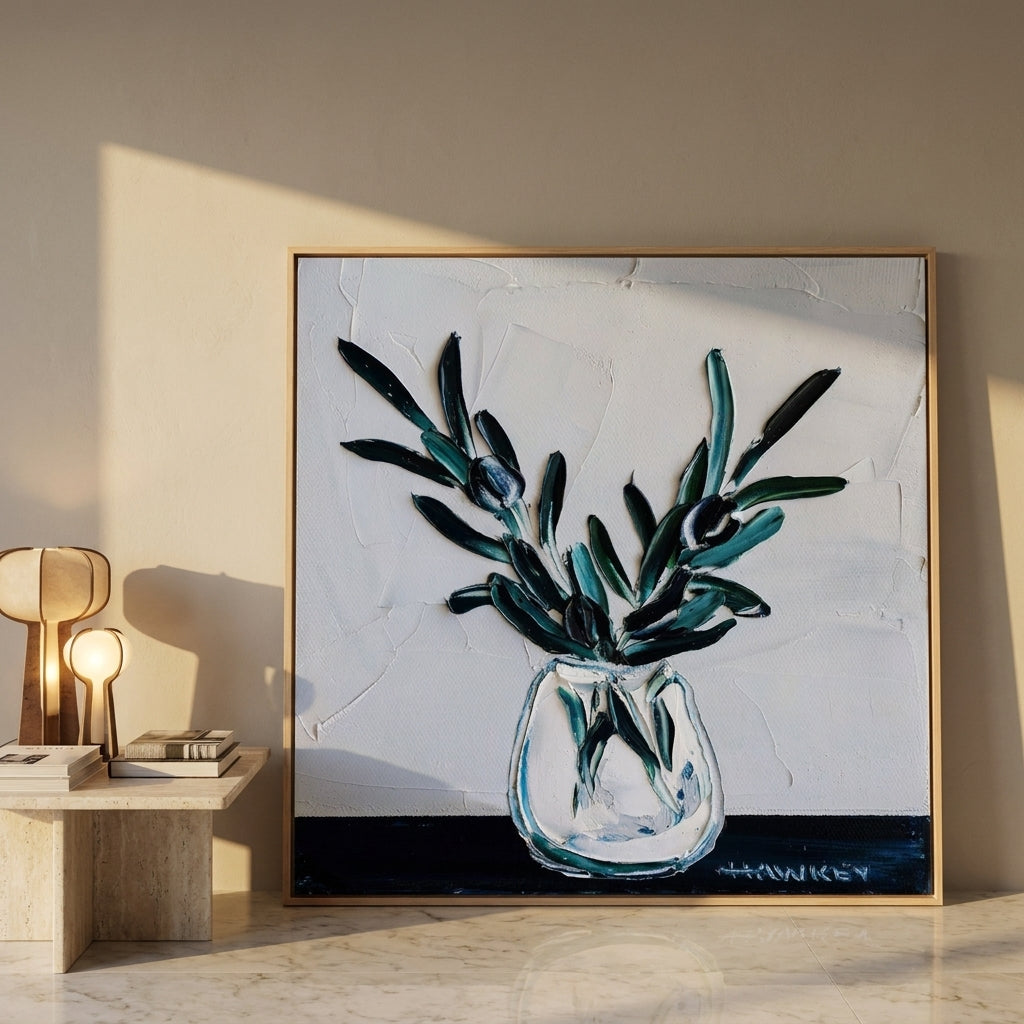 Oversized statement canvas wall art with a natural timber surround leaning against the wall in a luxe dining room