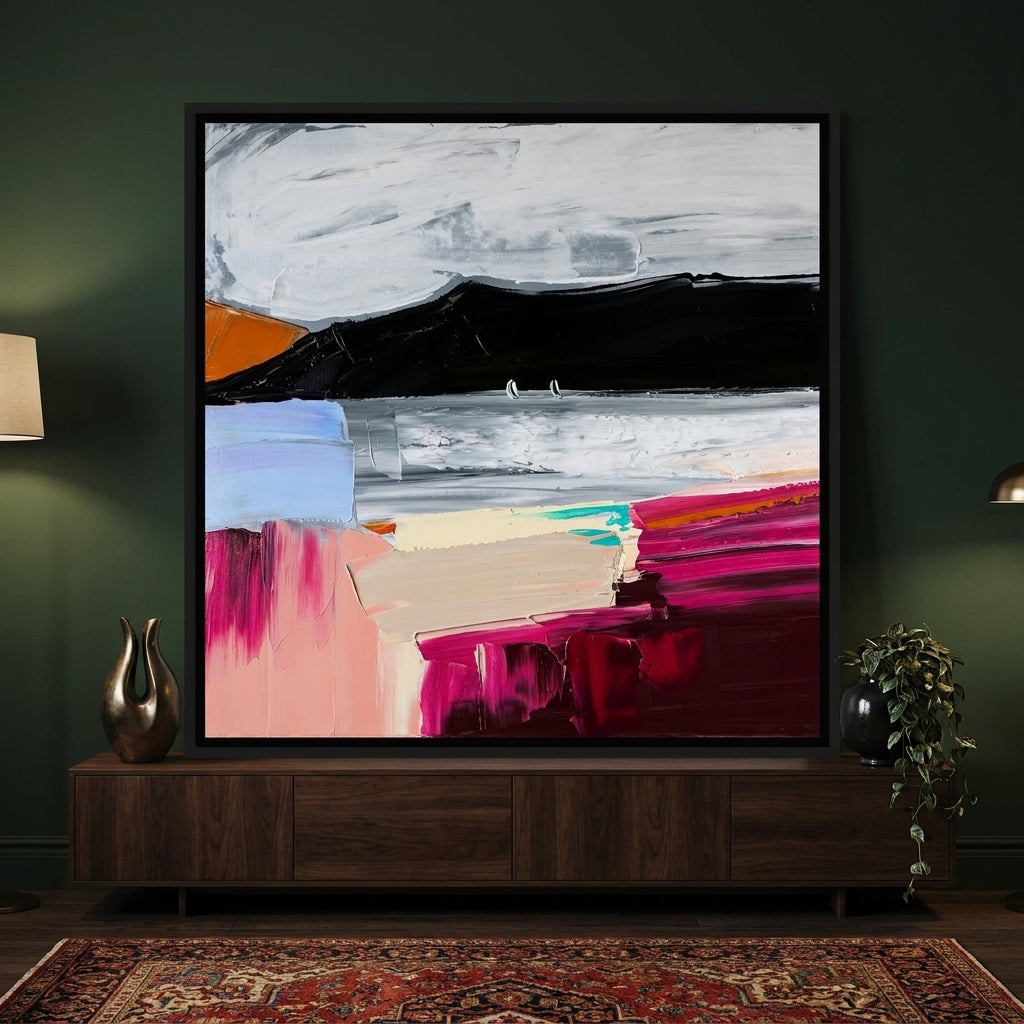 Canvas wall art with a black surround standing on a sideboard in a moody bedroom