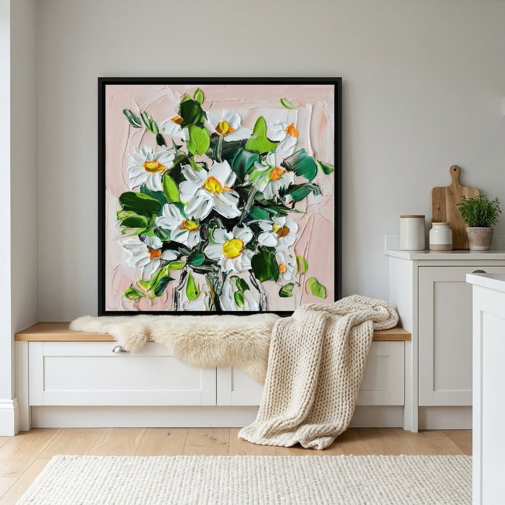 Canvas wall art with a black surround standing on a kitchen bench in a bright Scandinavian kitchen