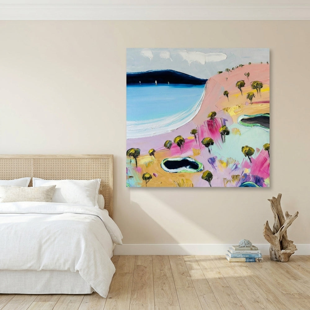 Stretched canvas wall art styled on the wall in a coastal bedroom
