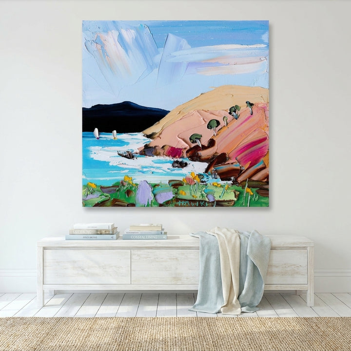 Stretched canvas wall art styled on the wall in a coastal living room