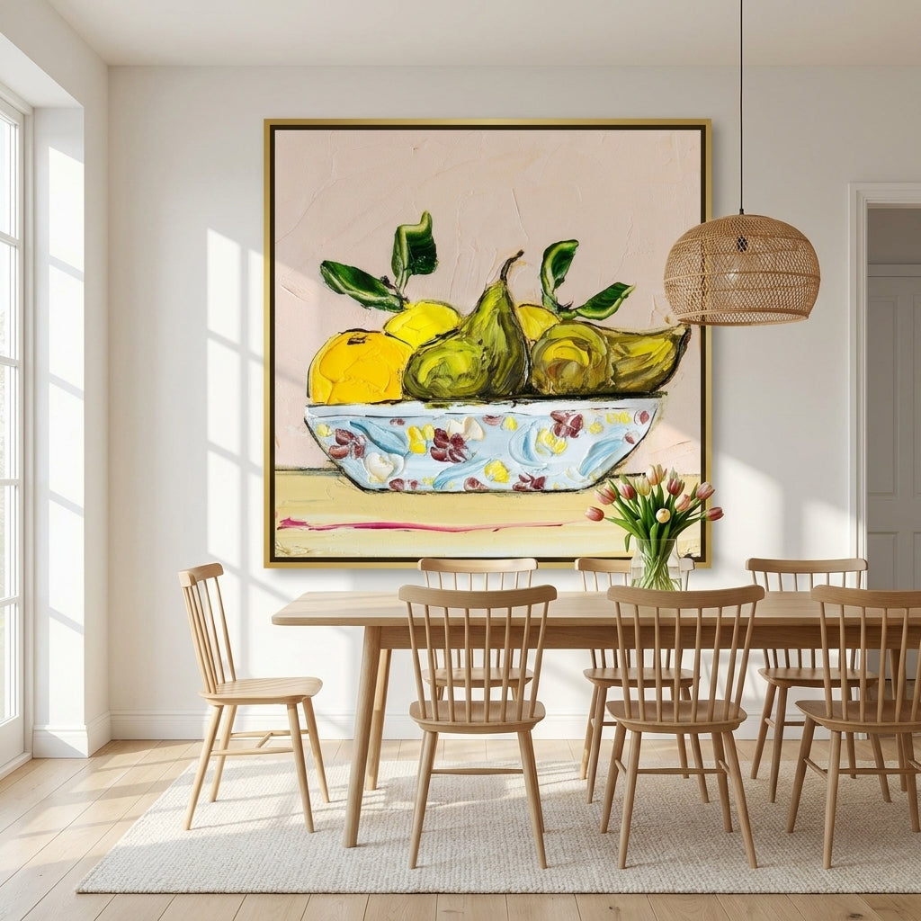 Oversized statement canvas wall art with a gold leaf surround styled on the wall in a bright Scandinavian dining room