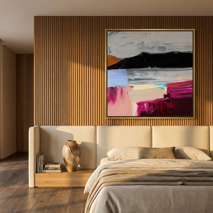 Oversized statement canvas wall art with a gold leaf surround styled on the wall in a luxe bedroom