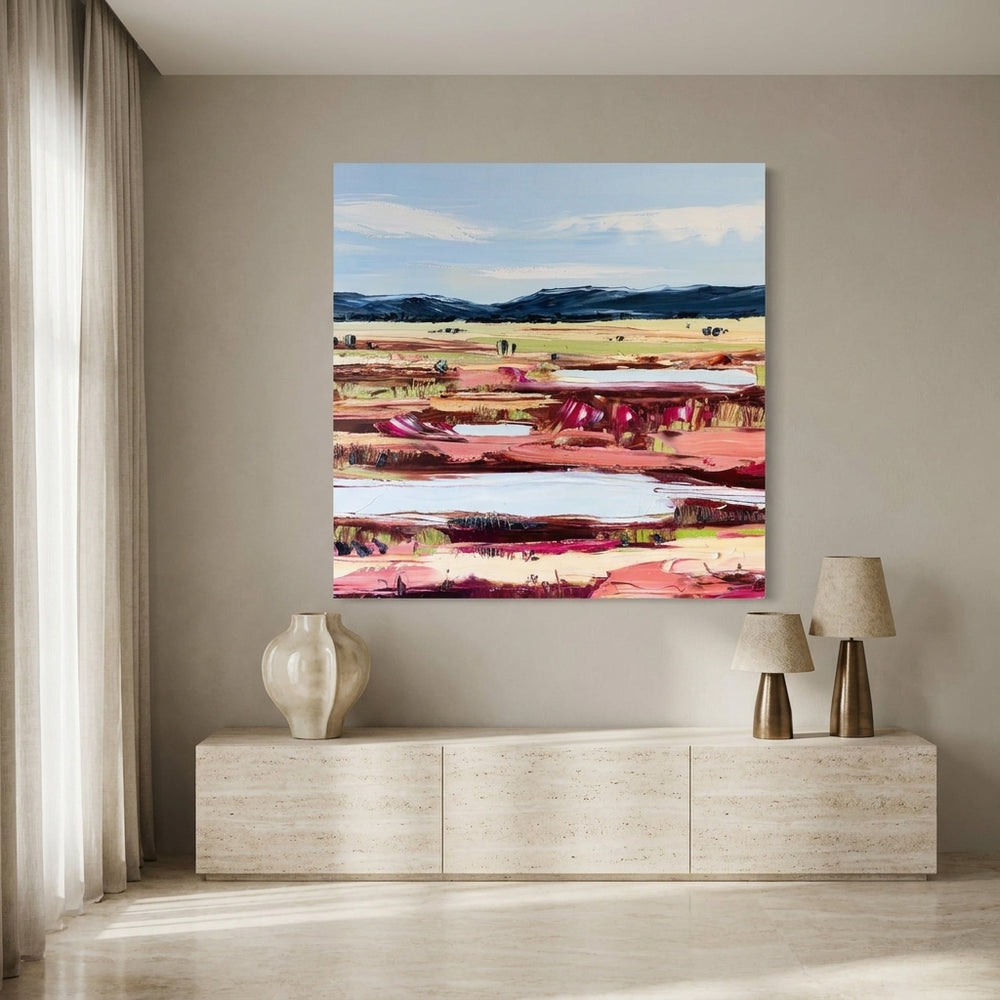 Stretched canvas wall art styled on the wall in a luxe living room